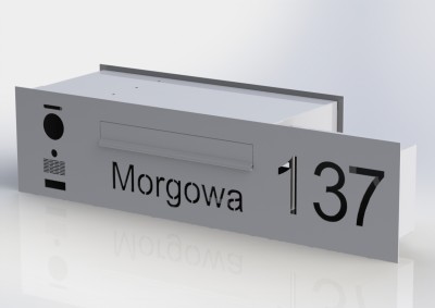 Przelotowa skrzynka na listy z wideodomofonem i poszerzonym panelem na napis 